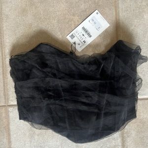 Black corset top with mesh details. NWT.